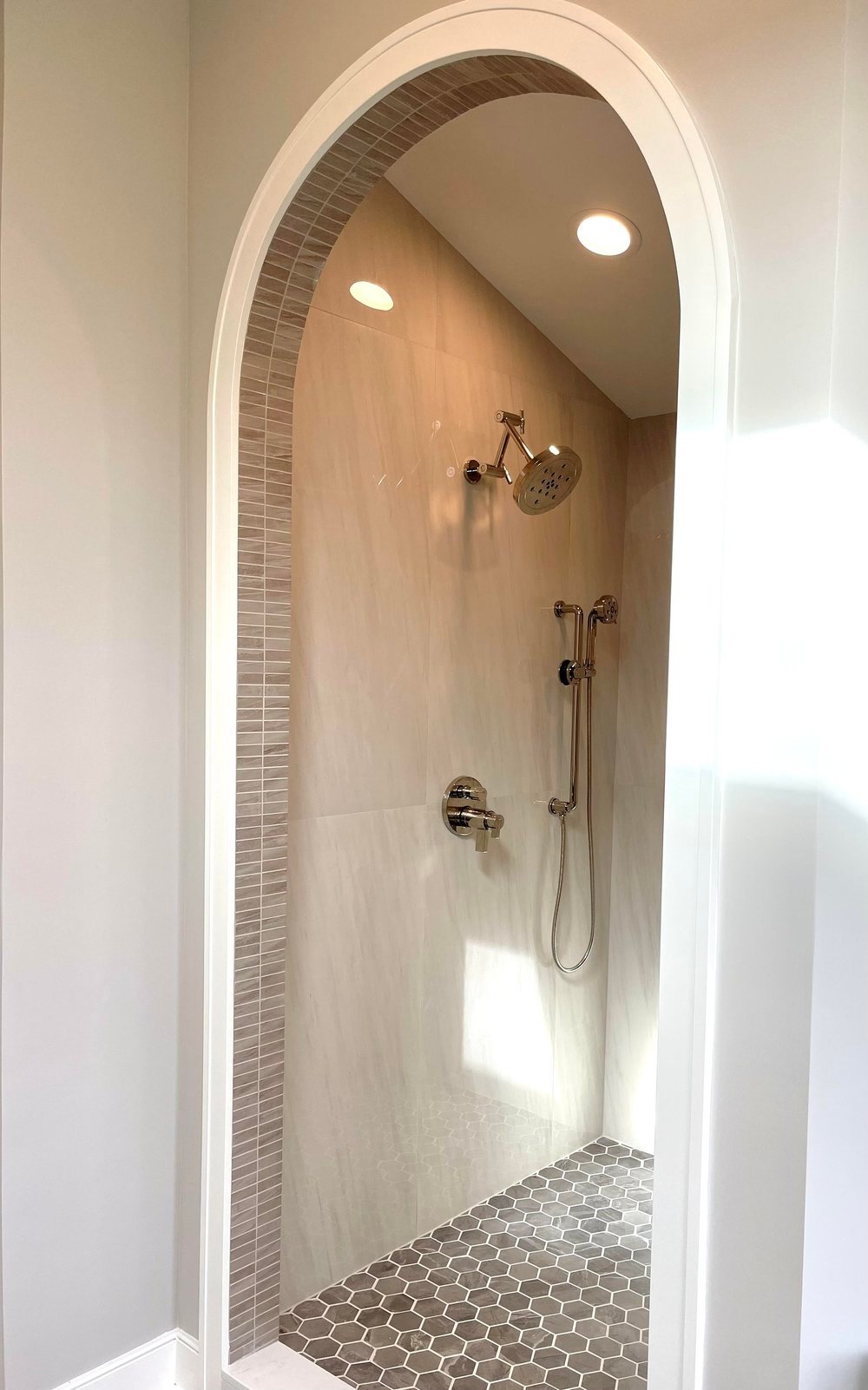 Bright and airy bathroom layout design featuring sleek white surfaces, gold fixtures, and a walk-in glass shower. This design showcases how simplicity and elegance can elevate your space. A stunning example of bathroom interior design done right.