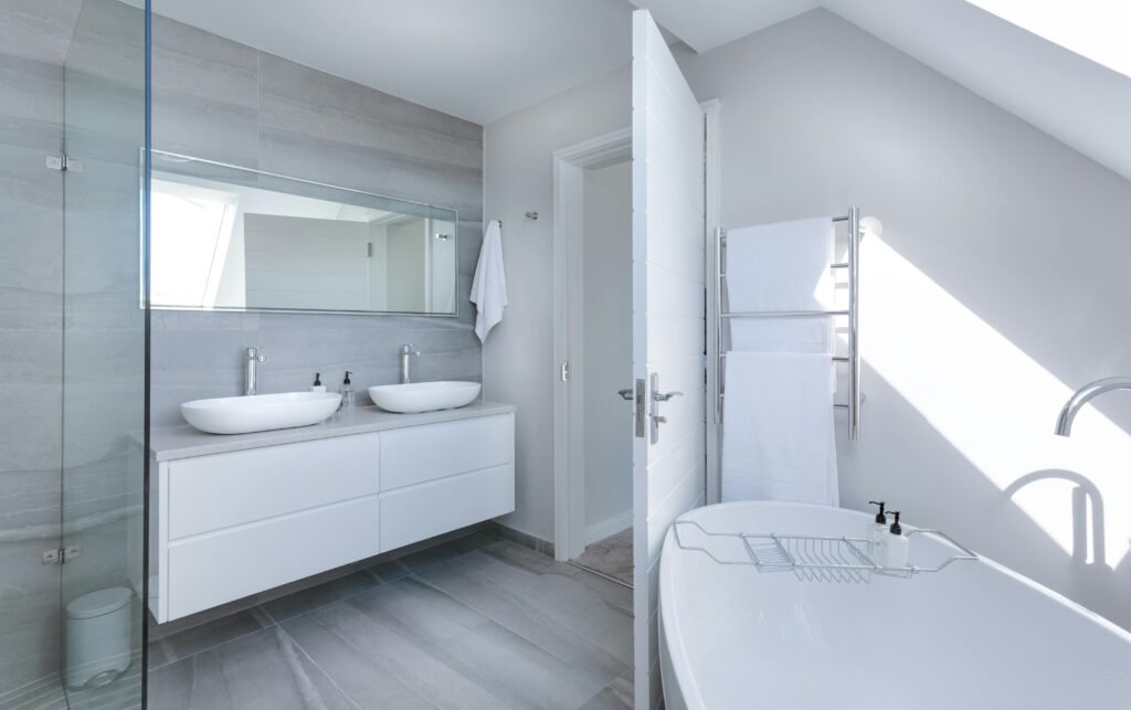 bathroom-interior-design Bright bathroom interior design with dual sinks, frameless glass shower, and modern fixtures - perfect balance of form and function.