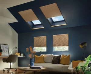 Window Treatments 6 Warm-toned Graber custom blinds cover skylights and windows in a cozy, modern living room. These custom window treatments filter natural light beautifully, blending effortlessly with the deep navy ceiling and neutral decor for a comfortable, inviting space.